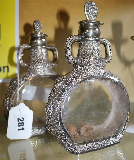 Pair of sterling overlaid decanters